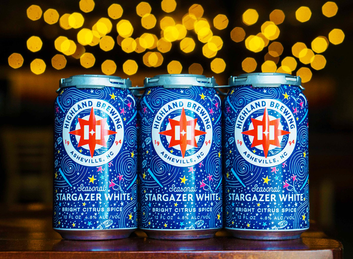 highland brewing co. stargazer white cans in front of lights