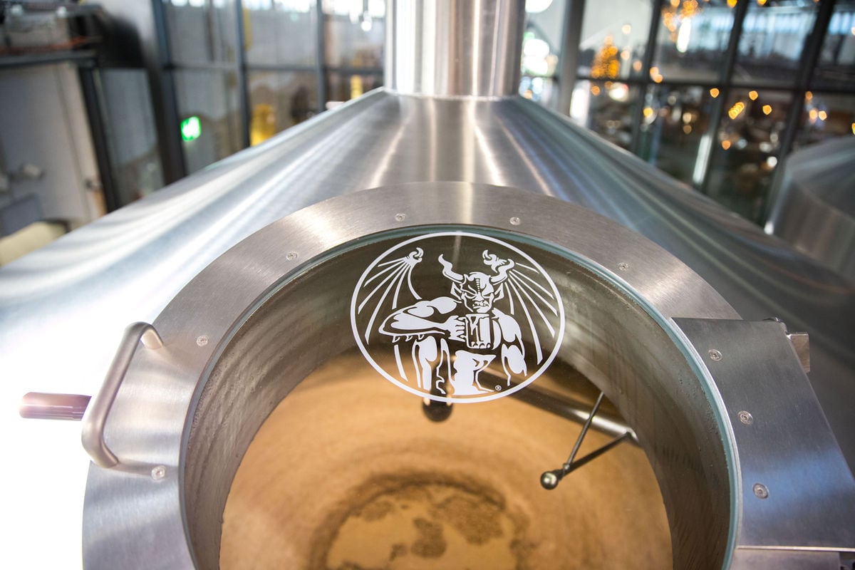 stone brewing berlin fermentation tank with stone logo