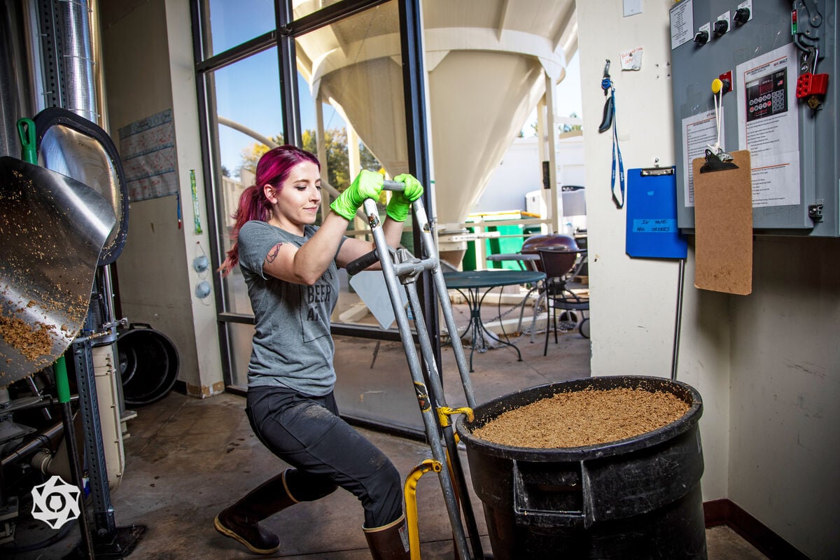 alyssa thorpe hauls a tub of wort