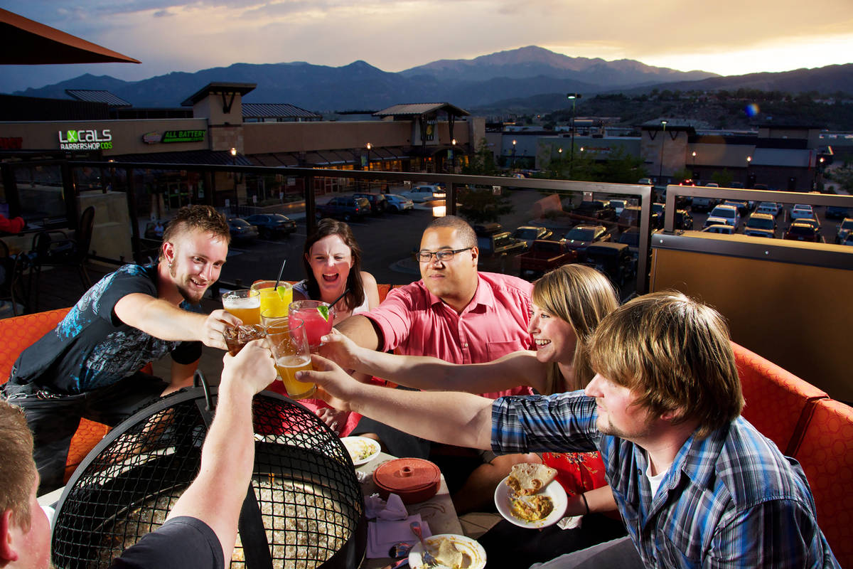 people clinking glasses in colorado springs, colorado