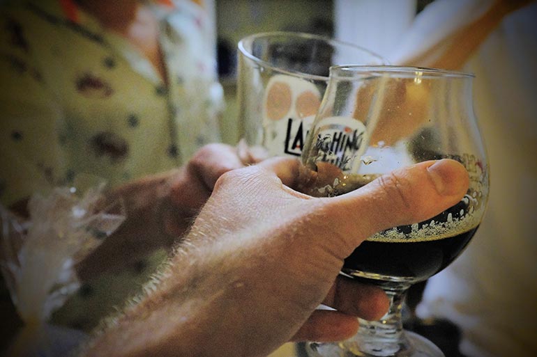 beer cheers at an indoor gathering