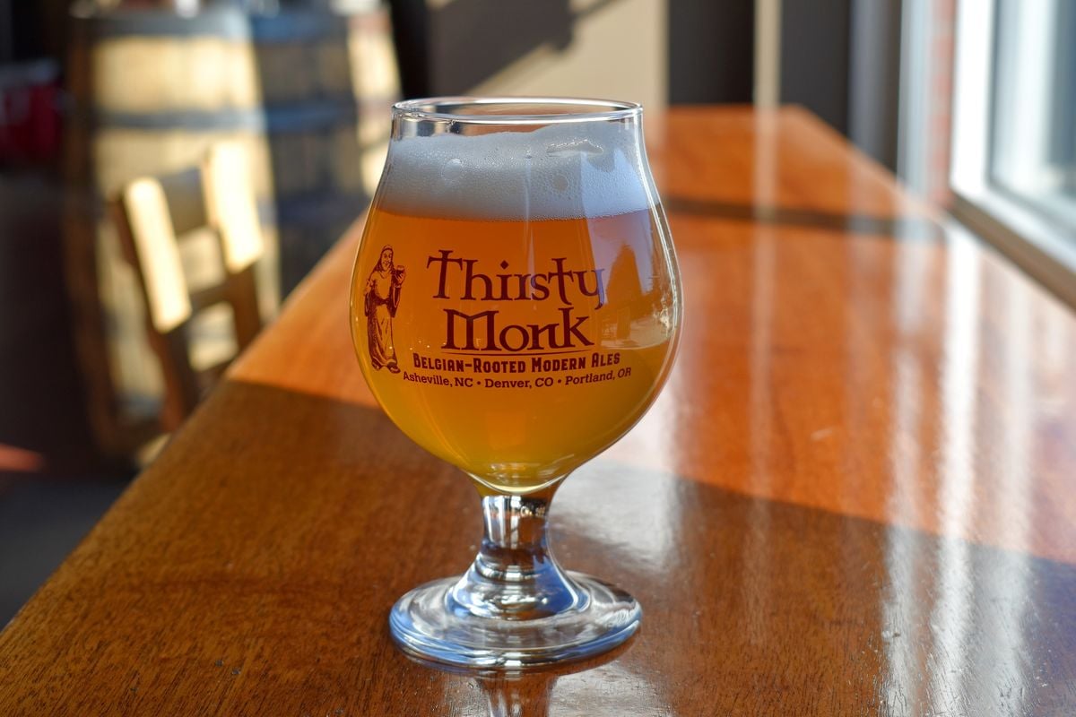 thirsty monk branded glassware on a table