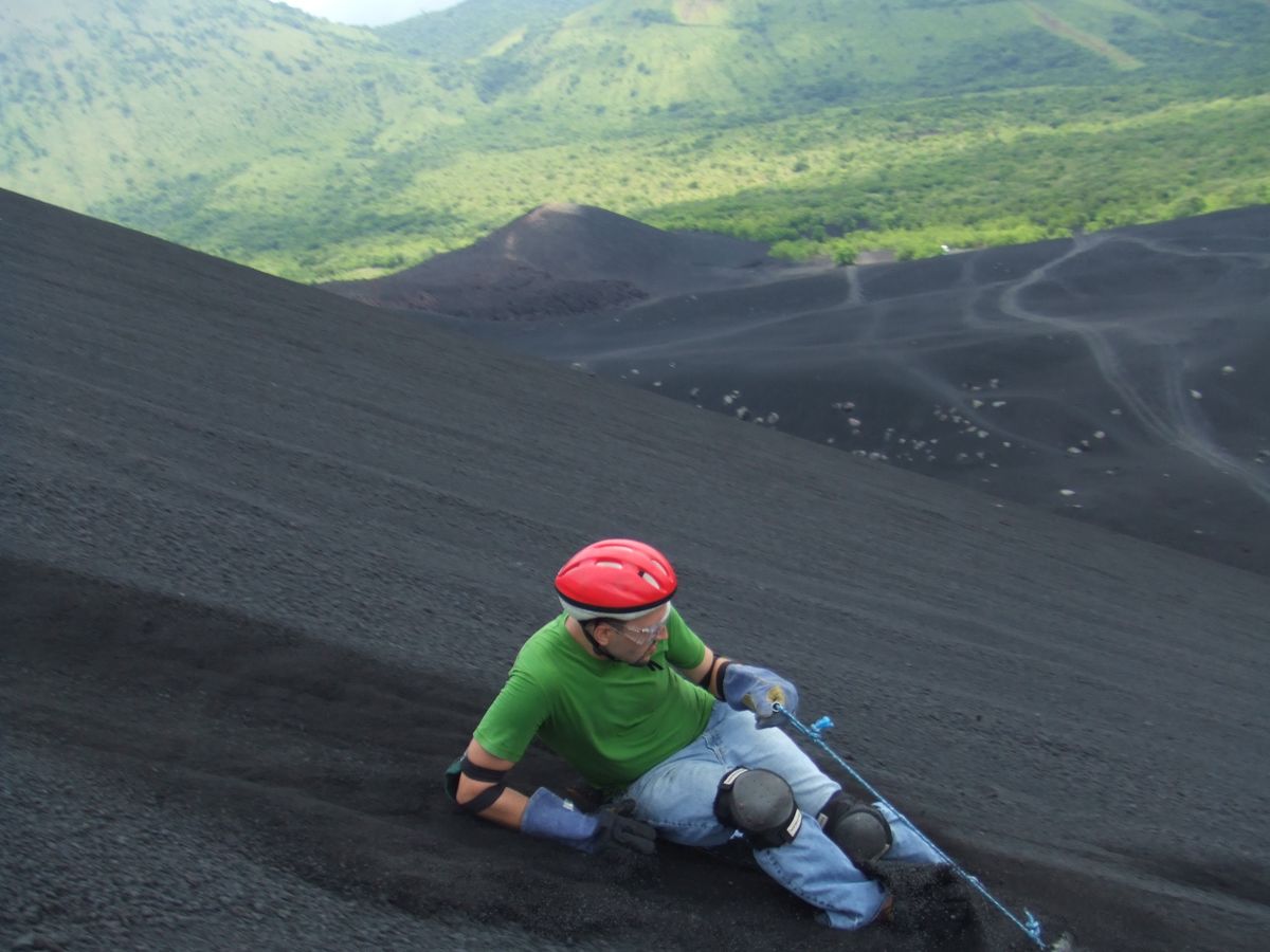 Tourist volcano surfing in Nicaragua